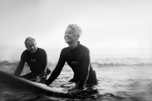 Senior couple surfing